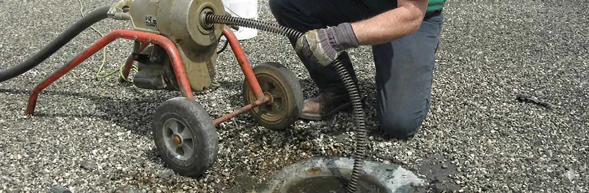 sewer rodding technician actively removing blockages from a sewer line in Columbus, OH