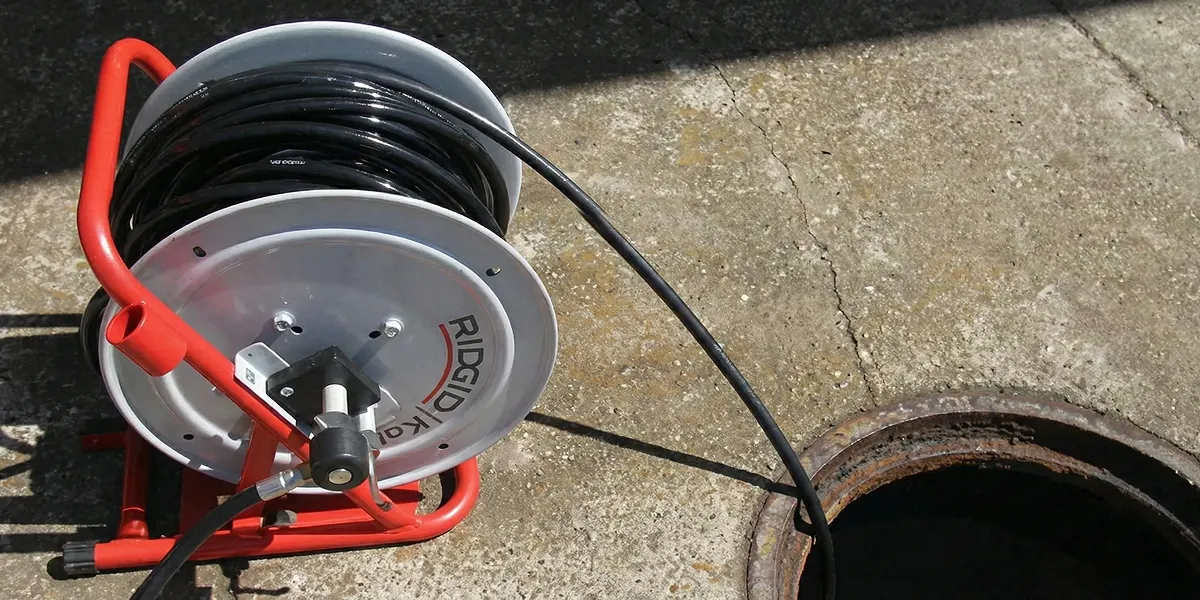 sewer rodding equipment prepared to clear clogged sewer lines in Columbus, OH